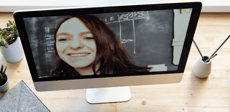 image of a video call on a computer screen showing an employee working at home